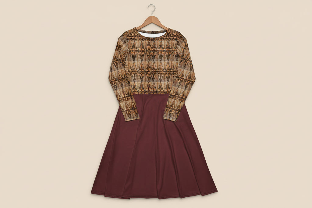 Two-piece outfit with patterned top and solid maroon skirt on a white background